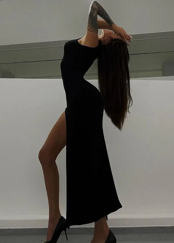 TRISS · VESTIDO MAXI HALTER CEÑIDO CON CUELLO ALTO Y ABERTURA LATERAL