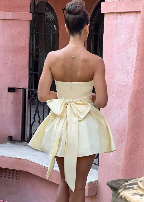 MARIELLA · VESTIDO MINI CON LAZO EN LA ESPALDA