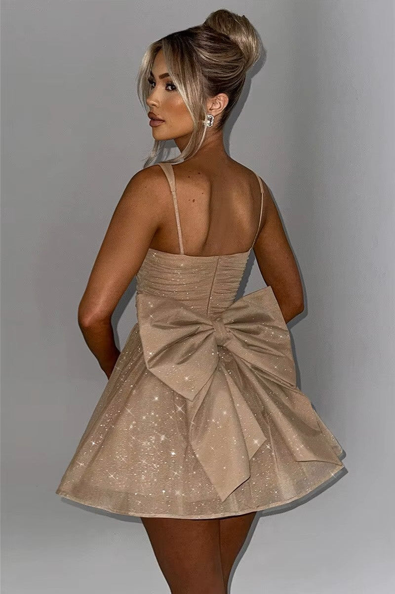 STELLA · VESTIDO MINI BRILLANTE CON LAZO EN LA ESPALDA