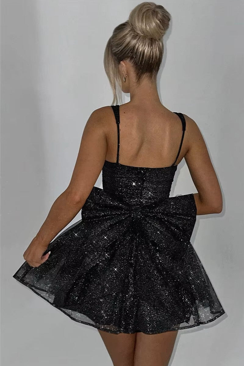 STELLA · VESTIDO MINI BRILLANTE CON LAZO EN LA ESPALDA