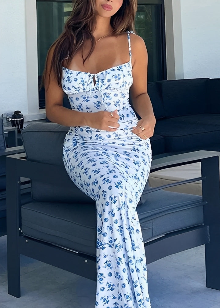 FIONA · VESTIDO MAXI FLORAL CON ESCOTE RECTO, TIRANTES DE LAZO Y CORTE AL BIES