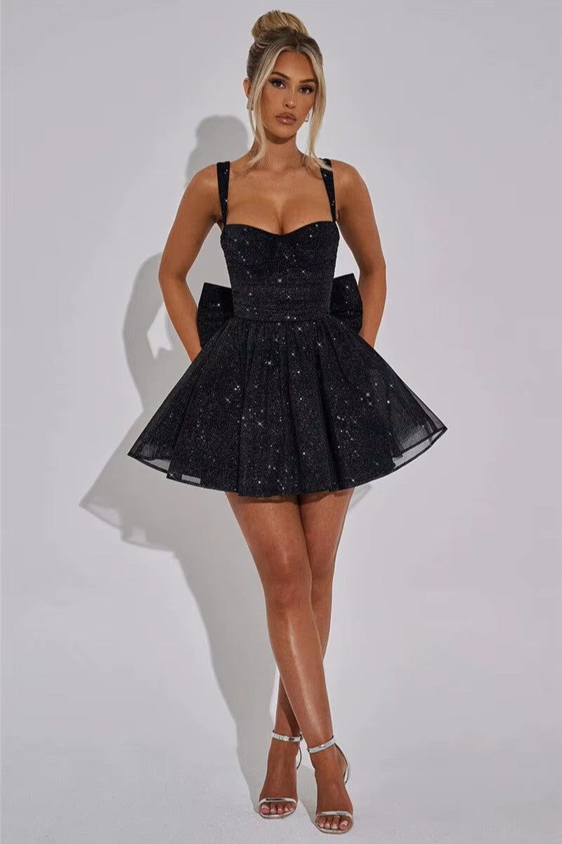 STELLA · VESTIDO MINI BRILLANTE CON LAZO EN LA ESPALDA